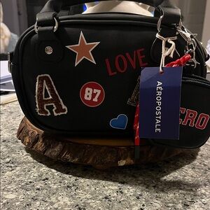 Aeropostale Black Duffel Bag with Colorful Patches